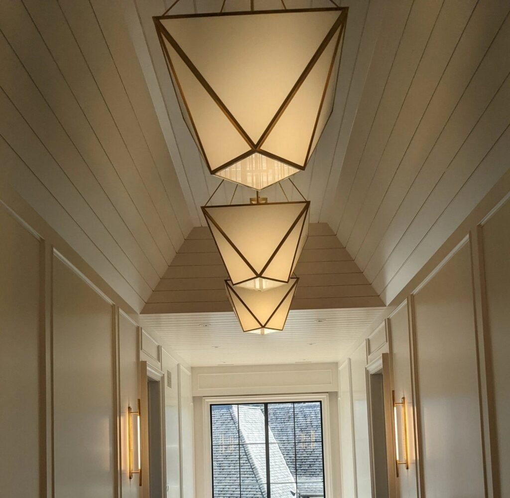 Finished hallway with tongue and groove ceiling and decorative wall trim